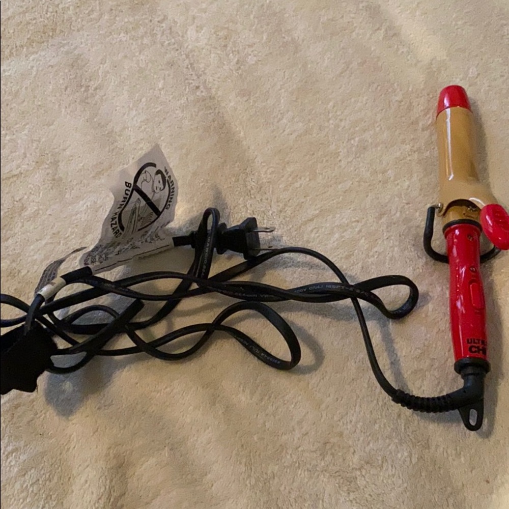 Red travel sized curling iron